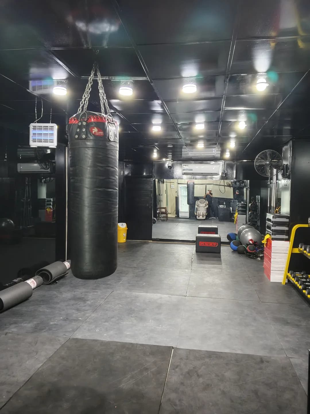 Hanging boxing bag and open studio floor