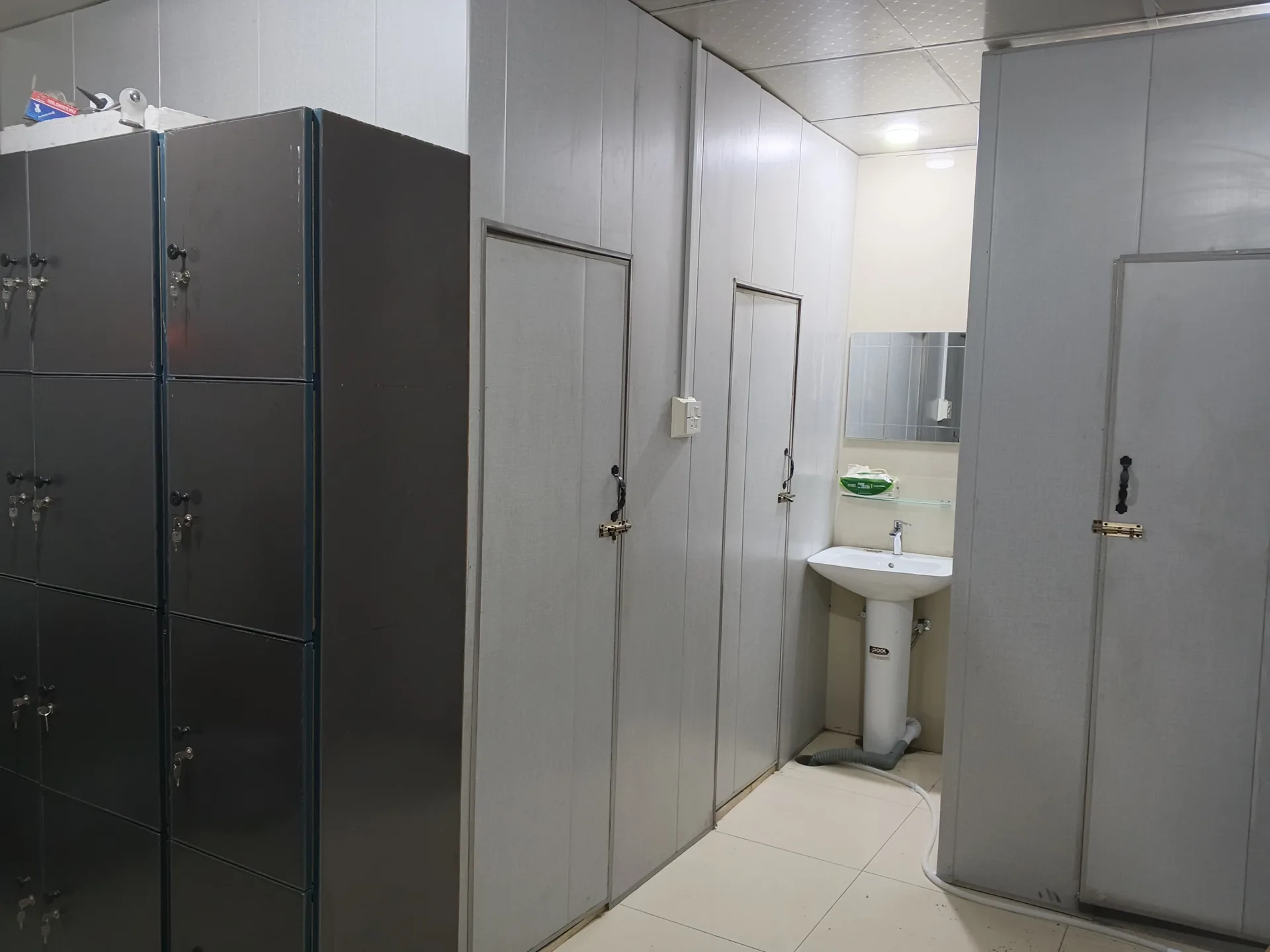 Grey lockers beside the studio washroom area